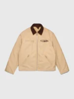 The front side of the Denim Tears Tear Star Work Jacket featuring button closures and symmetrical star graphics.