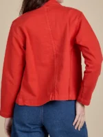 Back profile of the Unisex Denim Work Jacket in Mustang Red showing the smooth denim texture.