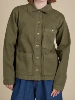 Front view of the Unisex Denim Work Jacket in Surplus Green featuring a military inspired hue.