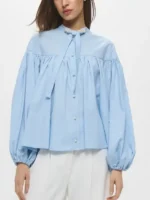 A stylish lifestyle look of the Emma Sidi Baby Blue Blouse.