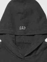 A focused look at the spacious hood and drawstring details of the Gap x Katseye Megan Hoodie.