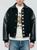 Close-up of the front closure on the Human Made Black Stadium Varsity Jacket.