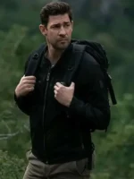 John Krasinski as Jack Ryan in black cotton jacket from Tom Clancy's Jack Ryan Season 3 with tactical backpack in forest