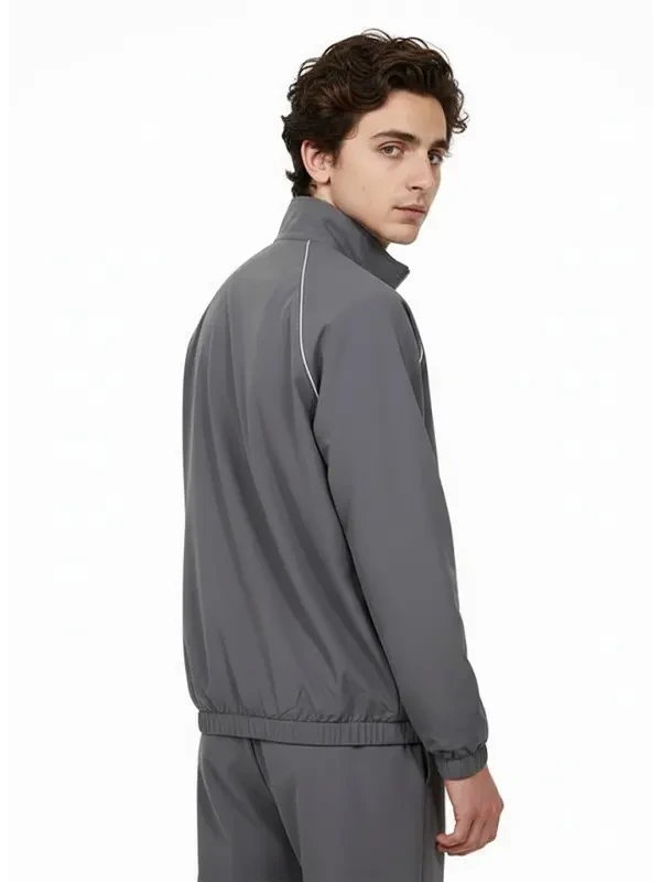 Rear profile of the Marty Supreme Gray Track Jacket showcasing a smooth and well-tailored back panel.