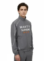 The front profile of the Marty Supreme Gray Track Jacket featuring a smooth zipper and stand-up collar.