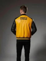 Marty Supreme Yellow Varsity Jacket back view showing rear design, shape, and smooth varsity finish