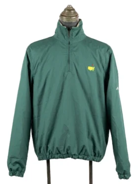 The front view of the fully reversed solid green Masters Reversible Jacket on a mannequin stand, featuring a quarter-zip mock neck design and the iconic green and yellow Masters golf tournament logo on the left chest.