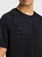 A detailed close-up of the fabric texture and neckline stitching on the Mercedes AMG F1 Night Driver T Shirt.