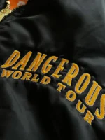 A full view of the Michael Jackson Dangerous Tour Jacket featuring its iconic military style and gold tone detailing.