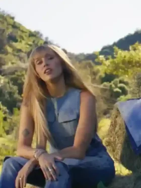 Lifestyle style shot of the Miley Cyrus Younger Now Blue Denim Vest.