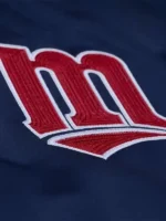 A specialized look at the intricate embroidery and high-sheen satin fabric of the Puckett Minnesota Twins Satin Jacket.