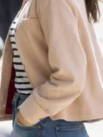 A detailed look at the front closure and zipper hardware of the Scream VI Jenna Ortega Pink Jacket.