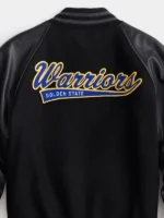 Detailed back view of the State Warriors Black Varsity Jacket.