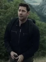 John Krasinski as Jack Ryan in Ghost Warriors episode wearing black cotton jacket with mountain landscape background in Season 3