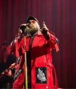 The front profile of the Teddy Swims 3Arena Red Long Coat featuring structured lapels and a clean button-down finish.