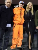 A complete profile shot of the Timothee Chalamet Marty Supreme Orange Tracksuit showing the matching top and bottoms.