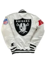A focused view of the intricate design details and collaborative logos on the Tom Brady White Raiders Jacket.