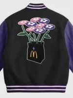 A specialized look at the large scale graphic artwork on the back of the Vandy x McDonalds HuntrX Varsity Jacket.