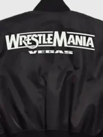 A specialized look at the artistic back graphics and collaborative branding of the WWE x XO Bomber Jacket.