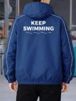 Blue Keep Swimming jacket back view showing text and wave graphic design