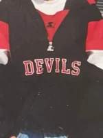 Vintage childhood photo of Sunny Mehta wearing the New Jersey Devils Starter pullover jacket as a teenager in New Jersey