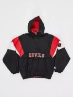 Front view of vintage New Jersey Devils Starter pullover jacket showing DEVILS lettering red white color block and NHL sleeve patch
