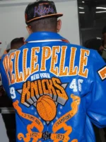 Back view of Fabolous x New York Knicks 2025 Pelle Pelle blue and orange bomber leather jacket with rhinestone Pelle Pelle script and 2-time NBA Champions Knicks artwork