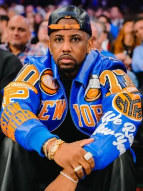 Rapper Fabolous courtside at Madison Square Garden wearing the New York Knicks Pelle Pelle blue and orange leather jacket
