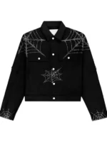 King Spider x Young Thug black denim jacket front showing white buttons and rhinestone spider web on chest and sleeve cuffs