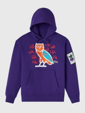 Full front flat lay of OVO x The Joker 2026 purple pullover hoodie showing OVO owl chest graphic Joker sleeve patch and kangaroo pocket