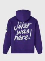 Full back view of OVO x The Joker 2026 purple hoodie showing Joker was here white script print and Joker patch on sleeve