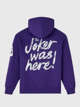 Full back view of OVO x The Joker 2026 purple hoodie showing Joker was here white script print and Joker patch on sleeve