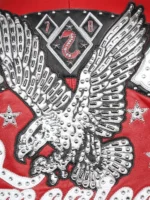 Close-up of rhinestone eagle embroidery on the back of Pelle Pelle American Bruiser red leather jacket with 1978 diamond badge
