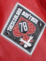 Close-up of These Colors Don't Run 78 diamond patch with red rhinestones on Pelle Pelle American Bruiser red leather jacket