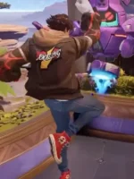 Marvel Rivals gameplay action shot of Peter Parker Photographer jacket showing AMAZING back print and red Converse sneakers