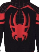 Close-up of red Miles Morales spider emblem on black hoodie chest with red web grid shoulders and double red sleeve stripes