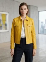 Woman wearing a yellow leather jacket with shirt collar, button closure, and chest pockets