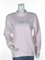 Front view of a pastel pink mockneck sweatshirt on a mannequin featuring a curved chest embroidery of varsity block letters outlined in white.
