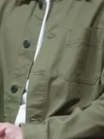 S02 David Giuntoli Green Jacket close-up view showing green fabric texture, stitching, and front details