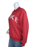 Three-quarter side angle view of a red varsity sweatshirt highlighting the raised mockneck collar and the textured block letter embroidery.