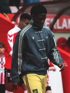 Man United player in grey Adidas Chinese New Year kung fu jacket with knot buttons at Premier League Matchday 36 vs Sunderland