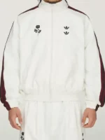 A premium standalone layout presentation of the clean Adidas x Willy Chavarria Woven Jacket.