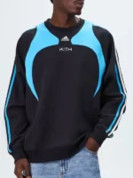 Full front presentation layout highlighting the clean graphic stitching on the Adidas Kith Lionel Messi Fleece Sweater.