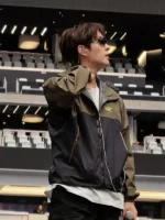 A premium standalone presentation of the olive green and black Arirang Suga Stanford Stadium Jacket.