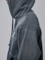 Side profile of the Gallery Dept Paint Logo Hoodie in dark grey.