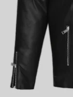 Close up detail of Jensen Huang leather jacket black showing zipper cuffs on full length sleeves and front zipper pocket silver hardware