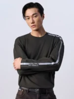 A clean profile view of the Jung Kook Calvin Klein Stripe Shirt in premium black fleece.