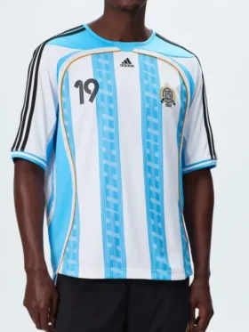 A premium standalone profile presentation of the blue and white striped Adidas x Kith Messi Football Jersey.