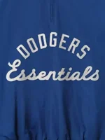 A premium profile view of the standalone LA Dodgers Essentials Half Zip Jacket showcasing the rich blue tone.
