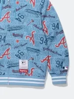 Full profile view of the Supreme Atlanta Braves Blue Hoodie highlighting the all over print design.
